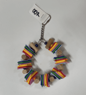 A colorful Foam Circle Stack bracelet with a chain attached to it.